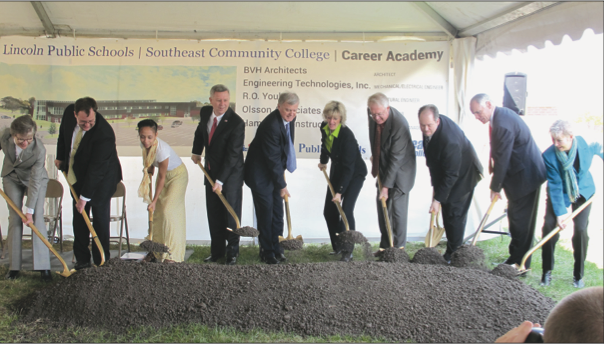 From left, Cathy Lang, Matt Blomstedt, Mikayah Worthon, Gov. Dave Heineman, Chris Beutler, Wendy Birdsall, Dr. Jack Huck, Don Mayhew, Dr. Steve Joel, and Kathy Boell- storff turn over ceremonial soil to commemorate the start of the SCC-LPS career center project.