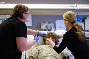 Respiratory Care students from SCC work on a mannequin displaying problems breathing.