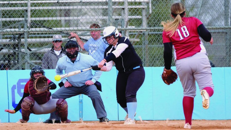 Brooke+Simonton%2C+a+second+year+first+baseman+from+Minden%2C+swings+during+a+double-header+loss+to+Hesston+College+in+March.